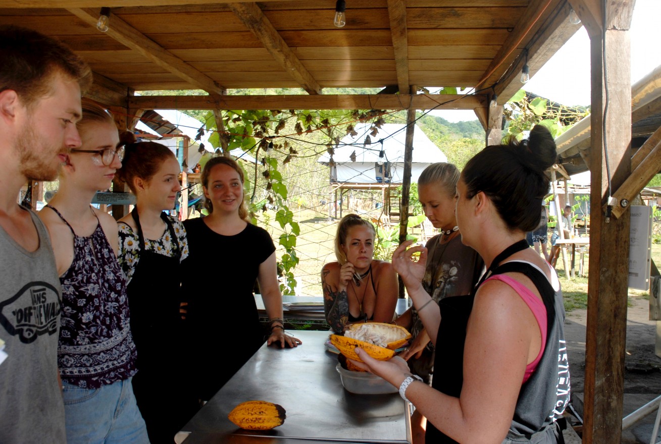 Diamond and her fellow culinary interns learn how to properly open a cacao bean with culinary teacher Kerri Selby.